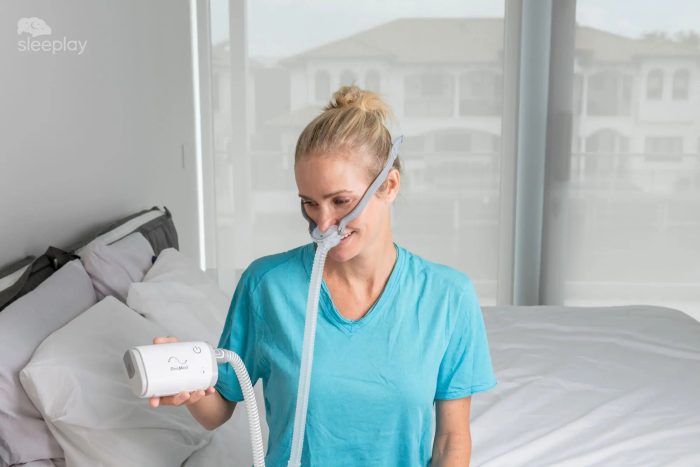 Woman using AirMini Travel CPAP