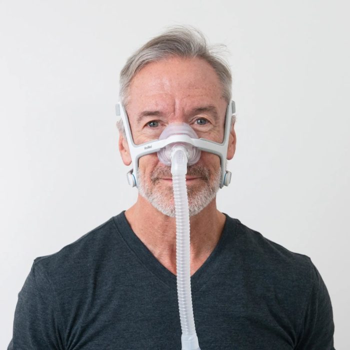 man using the resmed airfit n20 nasal cpap mask with headgear front view 3